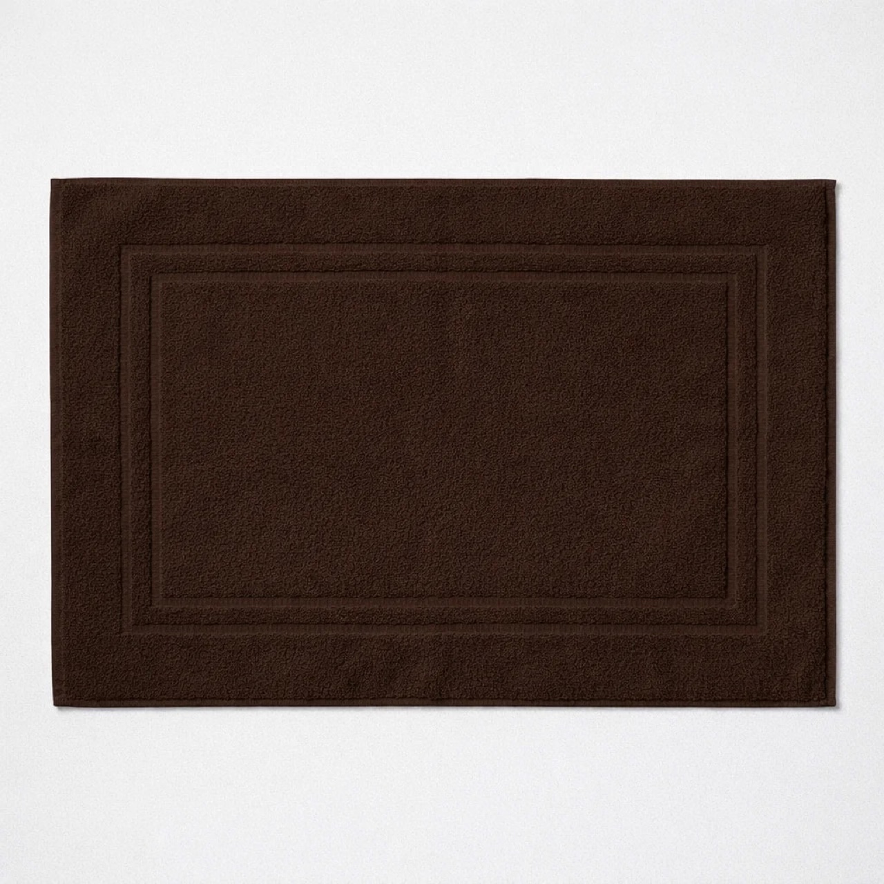 Dark brown Egyptian cotton bath mat with dense looped pile