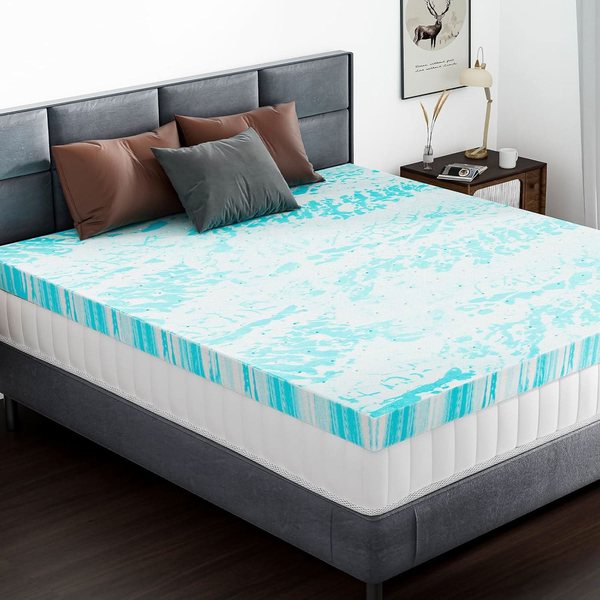 Aureon Labs Marshmallow mattress topper, a 3 inch gel-swirl foam slab with one corner folded back on a grey bed