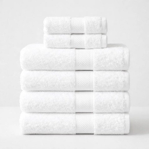 Stack of folded white Egyptian cotton bath towels